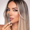 sugabuba glitter eyeliner metal glow model holding the product