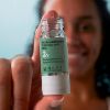 ETAT PUR SALICYLIC ACID 2% model holding the product